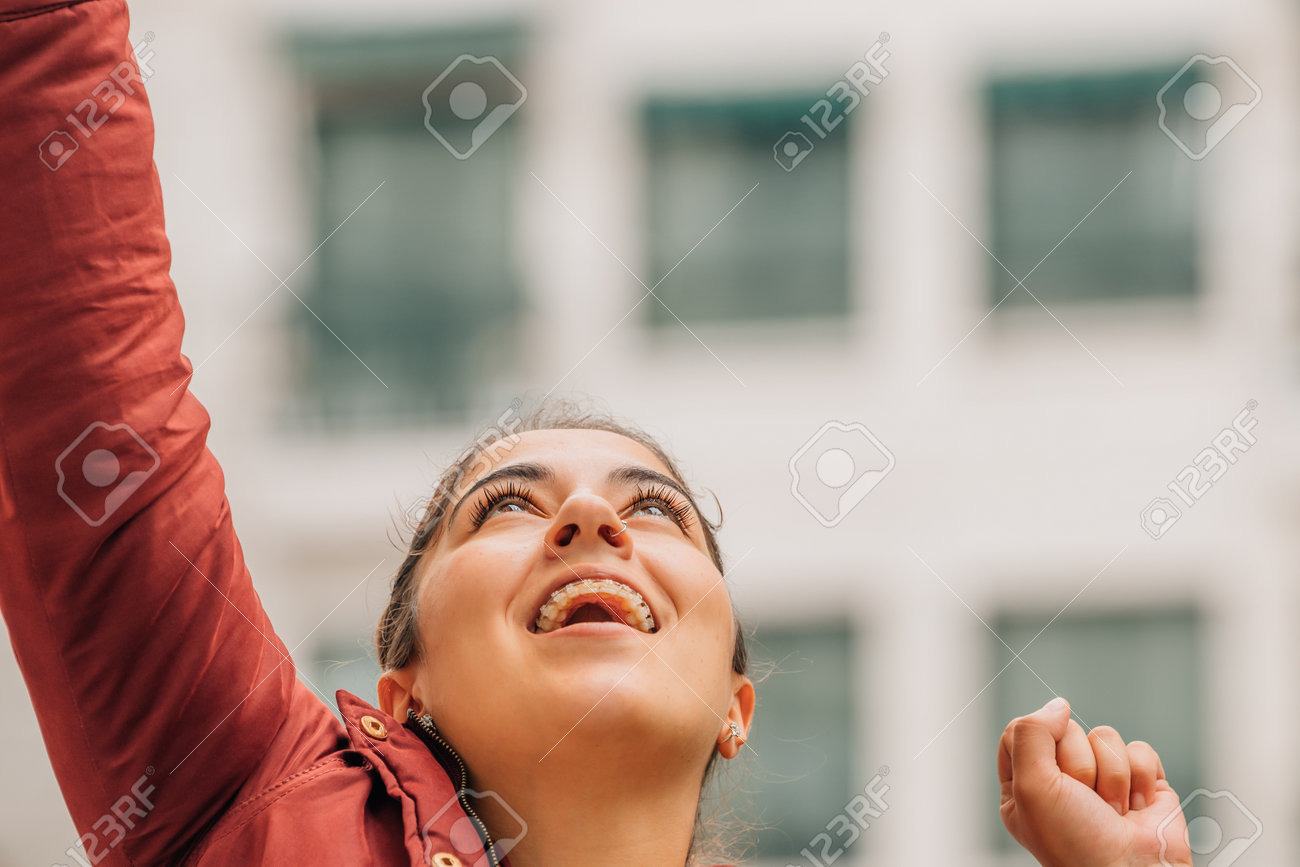 199980509-girl-excited-with-joy-on-the-street
